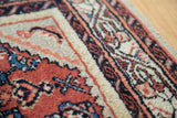 Hand knotted vintage Engelas rug pile showing cherry red, lavender, and azure patterns.
