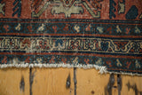 Frayed end and secured border detail of the distressed antique Lilihan rug.