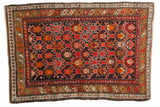 Vibrant geometric vintage Caucasian rug, tiger orange, crimson red, and charcoal tones, 3'2