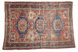 Distressed antique Soumac Caucasian rug, geometric patterns in red and blue, 4'2