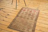 Antique Belouch rug corner, geometric gold, fiery red-orange motifs, pleasing wear.