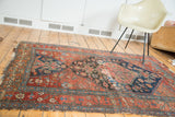Fragmented antique Halvaie Bijar rug with bold crimson and charcoal navy colors.