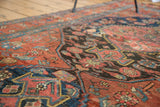 Distressed crimson red and charcoal antique Persian Bijar rug displaying worn pile and geometric patterns.