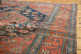 Fragmented Halvaie Bijar rug detail, with crimson field, navy patterns, and textured wear.