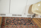 Vintage Borchalou rug with elegant serrated leaves on navy ground and a bright brick red border.