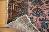Distressed raspberry blush pile with blue motifs and hand-knotted reverse of an antique Lilihan rug.