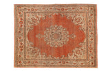 Antique Jalili Tabriz rug mat with a distressed rust orange field and ivory floral medallion.