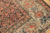 Antique Farahan Sarouk rug close-up: floral border with madder red, teal, and herati field.