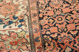 Detail of antique Sarouk rug's finely woven border: serrated leaves, lotus, terra cotta.