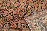 Finely woven back and faded terra cotta Herati pattern of an Antique Farahan Sarouk rug.