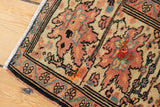 Antique Farahan Sarouk rug's banded border, with serrated leaves and faded terra cotta motifs.