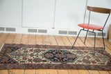 Distressed Antique Hamadan runner, hexagonal medallion, indigo, teal, and rust floral motifs on ivory.