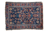 Distressed antique Lilihan mat, navy blue field, geometric allover pattern with rust and azure.