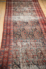 Distressed antique Malayer rug border with traditional geometric patterns and a blueberry paisley field.