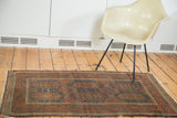 Antique Belouch rug displaying distressed even wear and unique large scale cobalt blue design.
