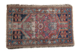 Distressed antique Lilihan rug, floral medallion in fuchsia, royal blue, and seafoam green.