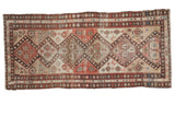 Distressed Antique Malayer runner: geometric diamonds, animal motifs in olive, salmon, ivory, walnut.