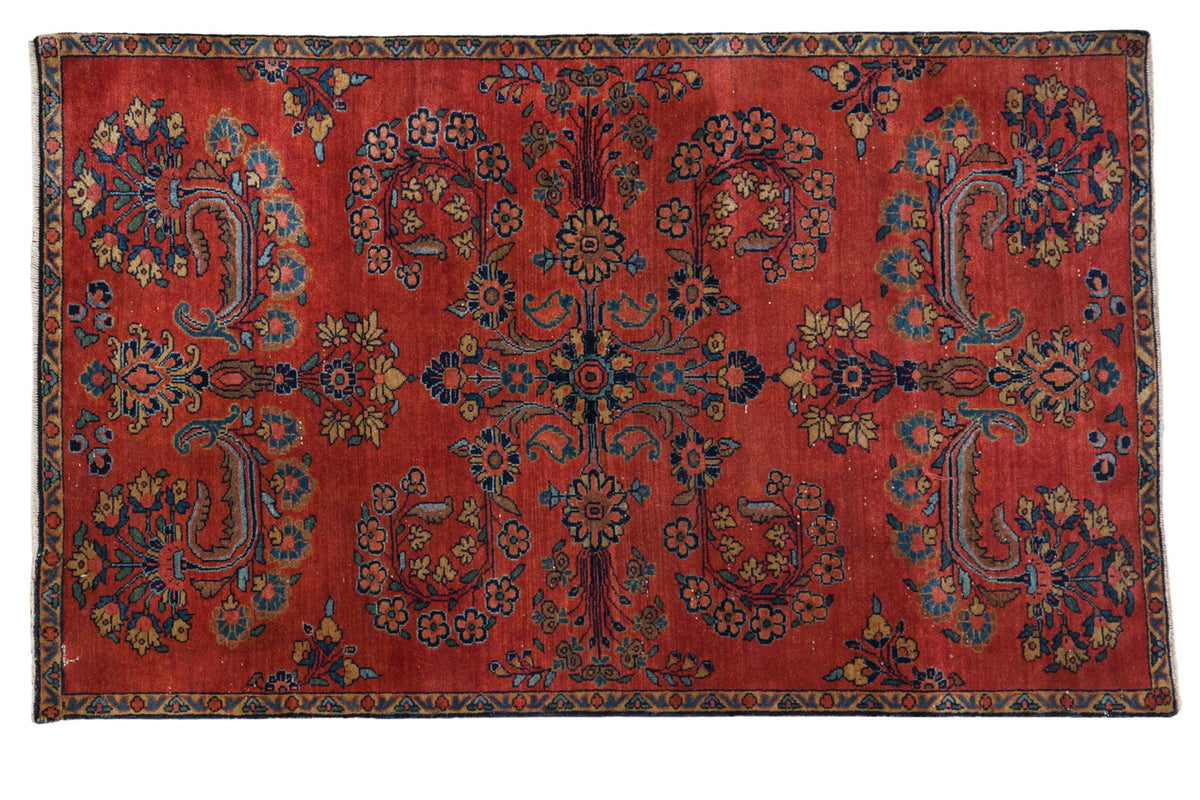 Vintage hand knotted Persian Manchester Kashan rug, cherry red field and blossoming florals.