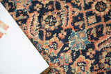 Distressed wool pile of a hand knotted Malayer rug, herati pattern in indigo, terra cotta, sage.