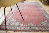 Decorative geometric border with arctic blue and faded terra cotta on distressed Mir Serbend rug.
