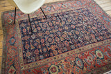 Colorful antique Northwest Persian rug, indigo field with allover herati motif, stylized samovar border.