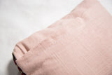 Rose Rug Fragment Pillow's blush pink rayon-linen backing with envelope enclosure.