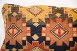 Unique antique rug fragment pillow, hand-made with geometric patterns and golden yellow abrash.