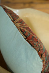 Terracotta and aqua blue Mahal rug fragment contrasted with soft aqua pillow fabric.