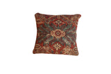 Antique Mahal Persian rug pillow with aged terracotta and aqua blue geometric medallion design.