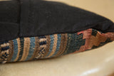 Small Kilim Pillow side edge with black linen and faded antique kilim weaving.