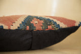 Faded antique Kilim fragment weave with textured patterns and black linen side.