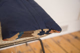 Navy brushed cotton backing and softened geometric patterns of the antique Kilim pillow.