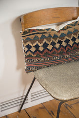 Kilim Throw Pillow featuring geometric pattern and white organic cotton backing.
