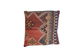 Antique Kilim Floor Pillow with faded geometric patterns in terracotta, blue, brown, and beige, 26x26 inches.