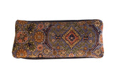 Purple Persian Bibikabad lumbar pillow with central medallion, floral motifs in orange, green, gold.