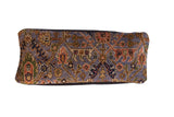 Purple Bibikabad rug fragment lumbar pillow with vibrant gold, navy, and rust Persian patterns.