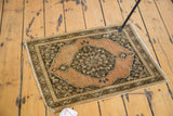 Antique Tabriz rug displaying its abrashed copper field, bold medallion, and intricate vine border.
