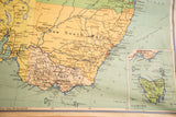 Vintage Australia Pull Down Map section of Tasmania and southeastern coast, with beige and blue.