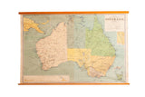 Vintage 1960s Australia political pull down map with muted green and yellow territories.