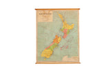 Vintage New Zealand pull-down map, 1960s, featuring colorful landmasses and wood dowels.