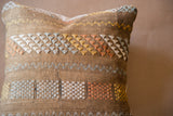 Cactus silk pillow with textured weave, geometric patterns in white, blue, yellow, and peach.