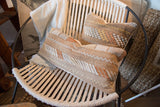 Cactus silk lumbar pillow with textured zigzag and stripe patterns in white, cream, and warm shades.