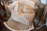 Two cactus silk lumbar pillows displaying varied geometric patterns in warm earthy tones.