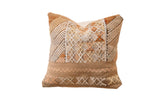 Textured sabra silk pillow with geometric diamond and zig-zag patterns in earth tones, 16x16.