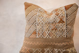 Repurposed cactus silk pillow with intricate textured diamond patterns in neutral tones.