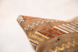 Cactus silk pillow showing textured weave with zigzag and dash patterns.