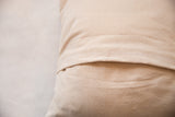 Pillow's natural organic cotton canvas backing with envelope closure.