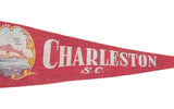 Vintage red felt Charleston SC pennant with white lettering and fabric texture.