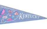 Blue felt pennant displaying 'The Bluegrass State' text and graphics of horse racers.