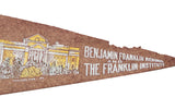 Detail of brown felt Benjamin Franklin Institute banner with white text and yellow building.